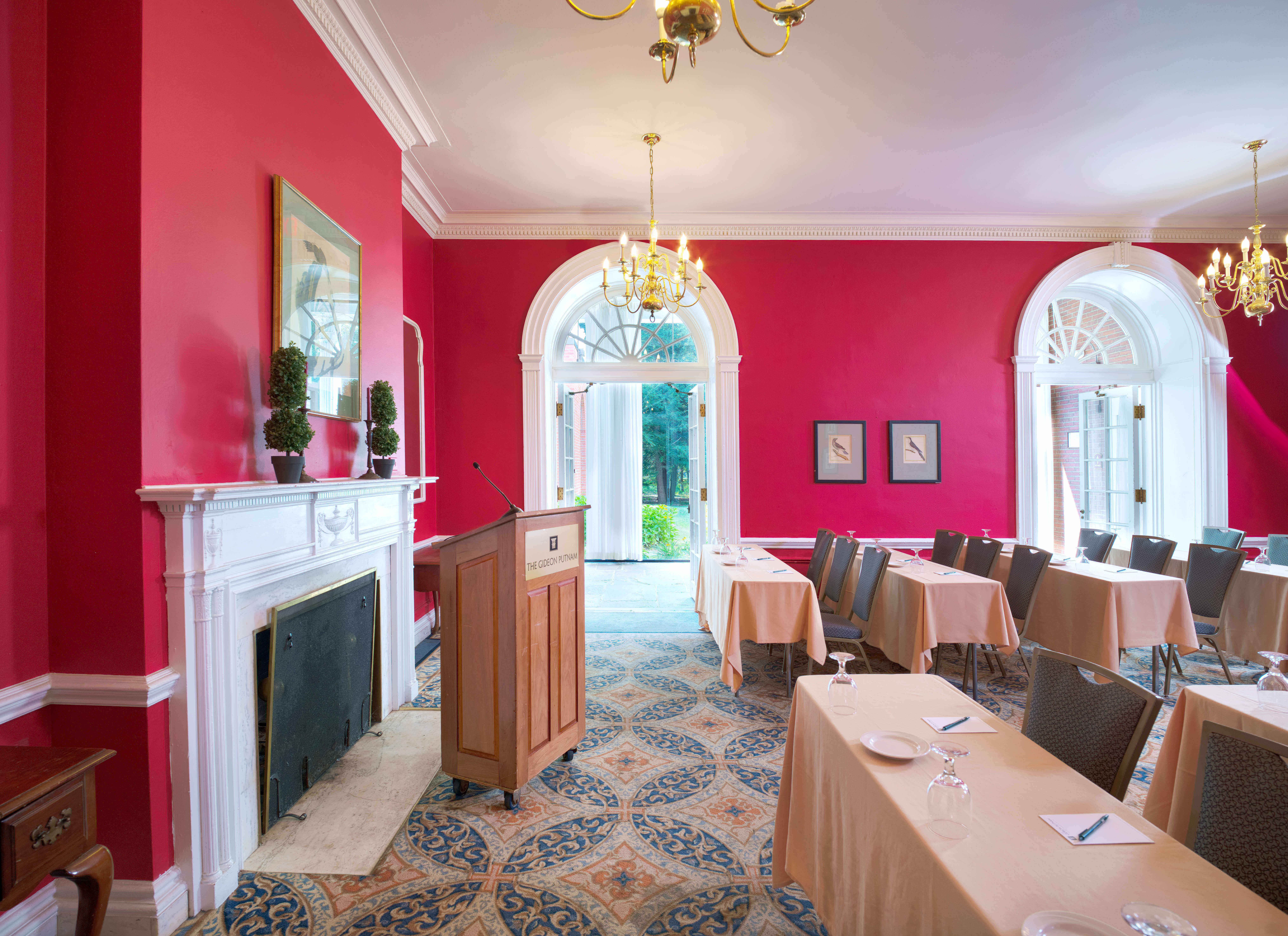 A room with a podium and tables.